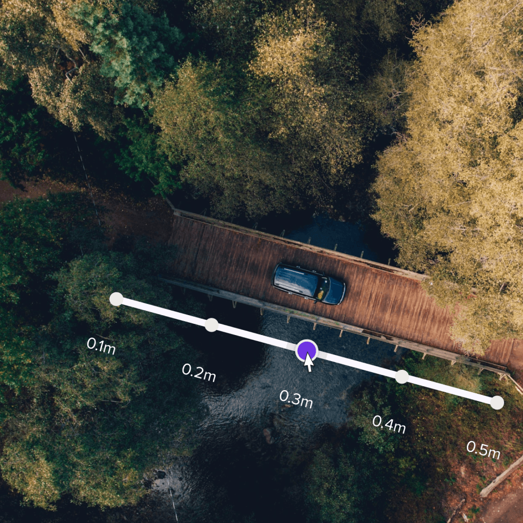 Aerial view of a bridge with it's size outlined